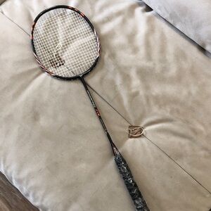 Black Badminton Racket with Orange Accents